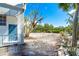 Secluded backyard featuring a lush tropical landscape and inviting outdoor space, perfect for relaxation and privacy at 20 Palm Dr, Placida, FL 33946