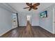 Cozy main bedroom with hard wood floors, large window, and an en-suite bathroom at 23148 Corvin Ave, Port Charlotte, FL 33954