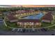 Scenic aerial view of a multi-Gathering home community with a serene pond and lush landscaping at 25100 Sandhill Blvd # R104, Punta Gorda, FL 33983