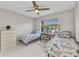 Bright, airy bedroom featuring tiled floor, two twin beds, and natural light at 25100 Sandhill Blvd # R104, Punta Gorda, FL 33983