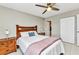 Bedroom featuring tile floors, ceiling fan, and ample natural light at 25100 Sandhill Blvd # R104, Punta Gorda, FL 33983
