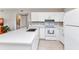 Modern kitchen featuring white cabinets, quartz countertops, and stainless steel appliances at 25100 Sandhill Blvd # R104, Punta Gorda, FL 33983
