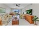 Cozy living room with a view of the lake and plenty of natural light at 25100 Sandhill Blvd # R104, Punta Gorda, FL 33983