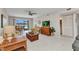 Cozy living room featuring a view of the water and access to the bathroom at 25100 Sandhill Blvd # R104, Punta Gorda, FL 33983