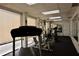 Well-equipped gym area featuring treadmills, weight machines, and mirrors for fitness enthusiasts at 25188 Marion Ave # F105, Punta Gorda, FL 33950