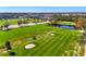 Aerial view of the community golf course, showcasing lush greenery and ponds at 3 Bermuda Cir # 49, Englewood, FL 34223