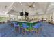 Spacious clubhouse bar with ample seating, stylish decor, and multiple TVs at 3 Bermuda Cir # 49, Englewood, FL 34223