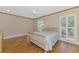 Bright bedroom featuring shutters on the window and a neutral color scheme at 3 Bermuda Cir # 49, Englewood, FL 34223