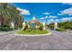 The community entrance features a well maintained island, signage and gate posts at 3 Bermuda Cir # 49, Englewood, FL 34223