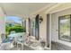 Charming front porch with stylish seating and decor, offering a welcoming entrance to the home at 3 Bermuda Cir # 49, Englewood, FL 34223