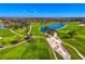 Scenic golf course view, featuring lush green fairways and pristine water features at 3 Bermuda Cir # 49, Englewood, FL 34223