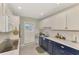 Charming kitchen with modern appliances and white subway tile at 3 Bermuda Cir # 49, Englewood, FL 34223
