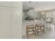Bright kitchen featuring white cabinets and stainless steel appliances at 3 Bermuda Cir # 49, Englewood, FL 34223