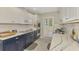 Charming kitchen with white subway tile and modern appliances at 3 Bermuda Cir # 49, Englewood, FL 34223