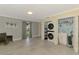 Spacious laundry room with washer, dryer, utility sink, and backyard view at 3 Bermuda Cir # 49, Englewood, FL 34223