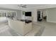 Bright living room features neutral furniture, a ceiling fan, and an open layout at 3 Bermuda Cir # 49, Englewood, FL 34223