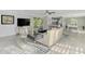 Open concept living room has modern decor and neutral color palette at 3 Bermuda Cir # 49, Englewood, FL 34223