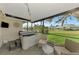 Outdoor patio with hot tub, seating, and views of the backyard and waterfront at 3 Bermuda Cir # 49, Englewood, FL 34223