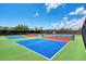 Outdoor pickleball courts with vibrant colors offer recreational opportunities for active residents at 3 Bermuda Cir # 49, Englewood, FL 34223