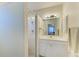 Bathroom features a glass-enclosed shower and a white vanity with a sink at 315 Southland Rd, Venice, FL 34293
