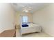 Cozy bedroom featuring neutral walls, tile floors, and a window at 315 Southland Rd, Venice, FL 34293