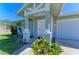 Charming single-story home featuring a well-manicured front yard and covered porch at 315 Southland Rd, Venice, FL 34293