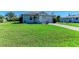 Charming single-story home featuring a well-manicured lawn and attached one car garage at 315 Southland Rd, Venice, FL 34293