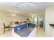 Open-concept view from the kitchen island into the adjacent living room at 315 Southland Rd, Venice, FL 34293