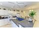 Spacious kitchen features white cabinets, a breakfast bar, and an adjacent dining area at 315 Southland Rd, Venice, FL 34293