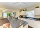Open concept kitchen with a peninsula provides seamless flow into the living area at 315 Southland Rd, Venice, FL 34293