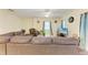 Inviting living room features a comfortable sectional sofa and a ceiling fan for added comfort at 315 Southland Rd, Venice, FL 34293