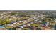 An aerial view showing the neighborhood with canals and varied home styles at 3265 Sunrise Trl, Port Charlotte, FL 33952