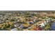A beautiful aerial view showcases a neighborhood with lush greenery and diverse residential properties at 3265 Sunrise Trl, Port Charlotte, FL 33952