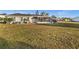 Expansive backyard with a screened-in porch perfect for outdoor entertaining and relaxation at 3265 Sunrise Trl, Port Charlotte, FL 33952