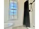 Bright bathroom with a walk-in shower and a window at 3265 Sunrise Trl, Port Charlotte, FL 33952