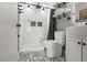 Modern bathroom featuring a sleek black shower and stylish tile floors at 3265 Sunrise Trl, Port Charlotte, FL 33952