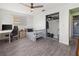 Bedroom with hardwood floors, ceiling fan, closet, desk and plenty of natural light at 3265 Sunrise Trl, Port Charlotte, FL 33952