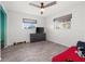 Bright bedroom with wood-look flooring, ceiling fan, and natural light at 3265 Sunrise Trl, Port Charlotte, FL 33952