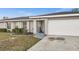 Charming single-story home with tidy landscaping, and an attached two-car garage at 3265 Sunrise Trl, Port Charlotte, FL 33952