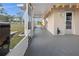 Enclosed back patio, with outdoor lighting, perfect for relaxing and entertaining at 3265 Sunrise Trl, Port Charlotte, FL 33952