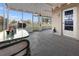 Enclosed patio with outdoor furniture, string lights, and a view of the backyard for comfortable outdoor living at 3265 Sunrise Trl, Port Charlotte, FL 33952
