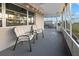 Covered screened-in patio with seating, providing a comfortable outdoor space for relaxation and entertainment at 3265 Sunrise Trl, Port Charlotte, FL 33952