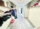 Spacious walk-in closet with shelving units and hardwood floors offer ample storage and organization options at 3265 Sunrise Trl, Port Charlotte, FL 33952