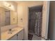 Bathroom featuring a vanity with a sink and a shower with a neutral-toned curtain at 3300 Loveland Blvd # 2103, Punta Gorda, FL 33980