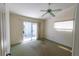 Bright bedroom featuring a sliding door and a window allowing natural light to fill the room at 3300 Loveland Blvd # 2103, Punta Gorda, FL 33980