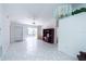 Open-concept living area featuring tiled floors, recessed lighting, and a ceiling fan at 3300 Loveland Blvd # 2103, Punta Gorda, FL 33980