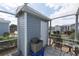Screened-in patio area with storage shed, table, and chairs for relaxing outdoors at 3300 Loveland Blvd # 2103, Punta Gorda, FL 33980