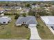 An aerial view of the house in its neighborhood, highlighting its location and surrounding landscape at 4461 Baroda Ave, North Port, FL 34287