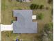 Aerial view of home featuring a well maintained roof, landscaping, and driveway at 4461 Baroda Ave, North Port, FL 34287