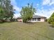 Expansive backyard with lush greenery, offering a serene outdoor space at 4461 Baroda Ave, North Port, FL 34287